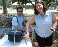 Angela Bliss and Jonathan Raul set up water quality sensors