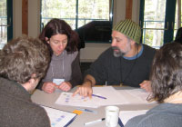 UMaine graduate students and post docs collaborate on a concept map with researcher David Fields